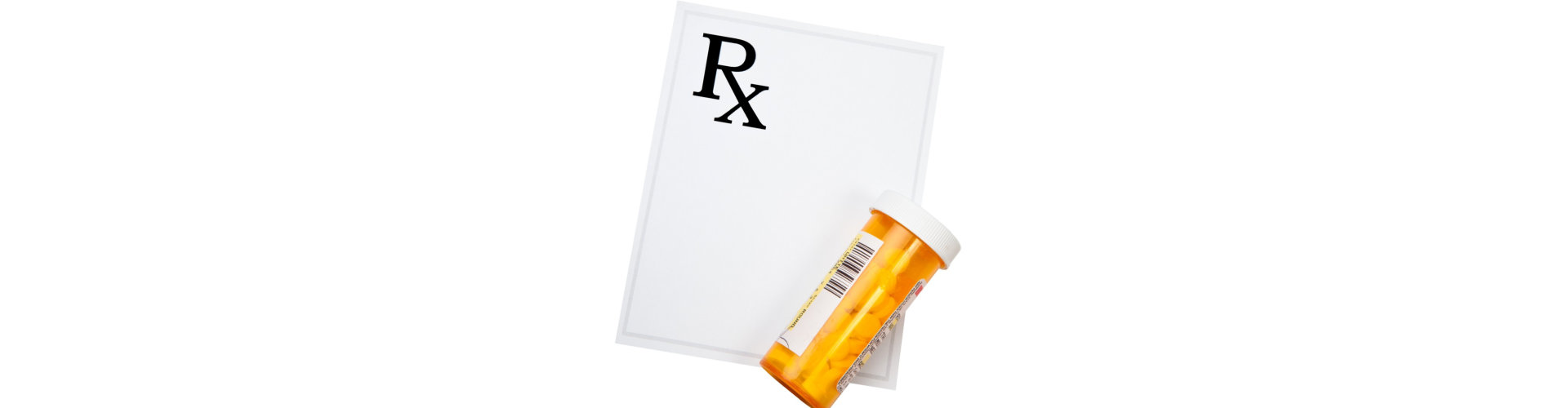 prescription drug bottle and blank prescription pad